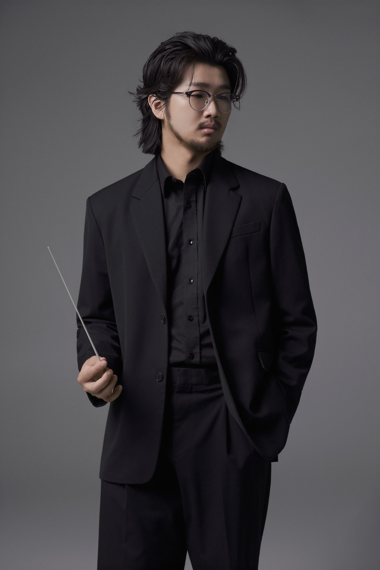 Eric B.J Kim seated, full-length portrait