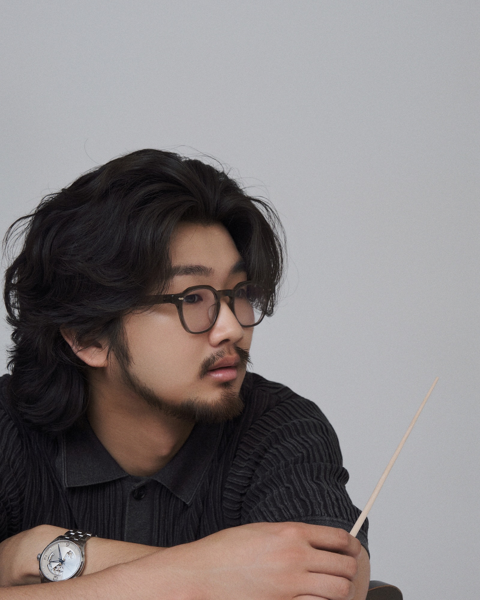 Eric B.J Kim, portrait in black suit